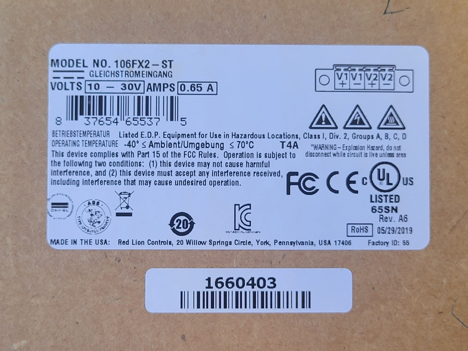 Product label with specifications and certifications on a cardboard background