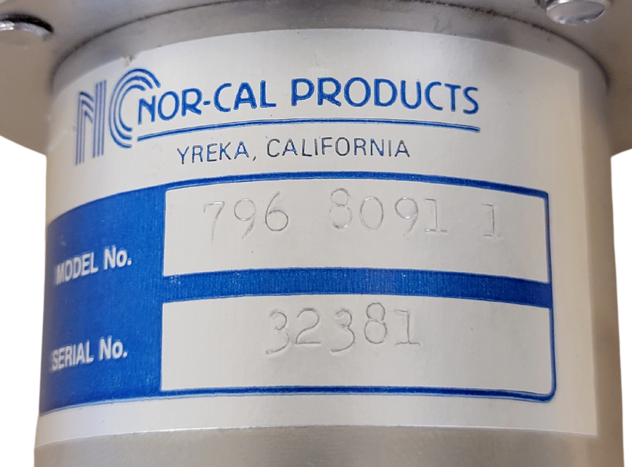 Nor-Cal Products label on a cylindrical metal component