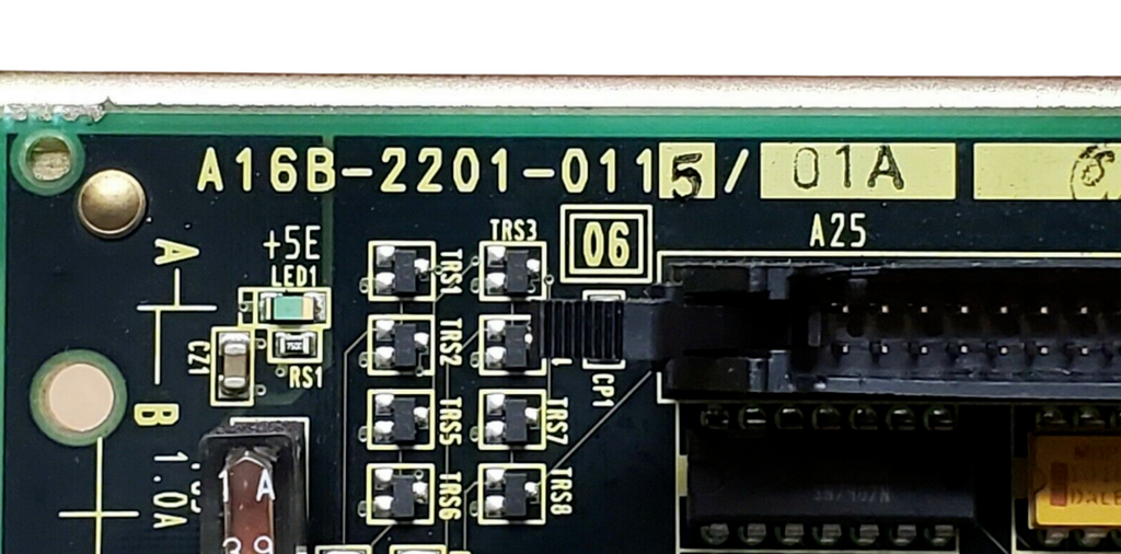 Close-up of a computer motherboard with various components and labels.
