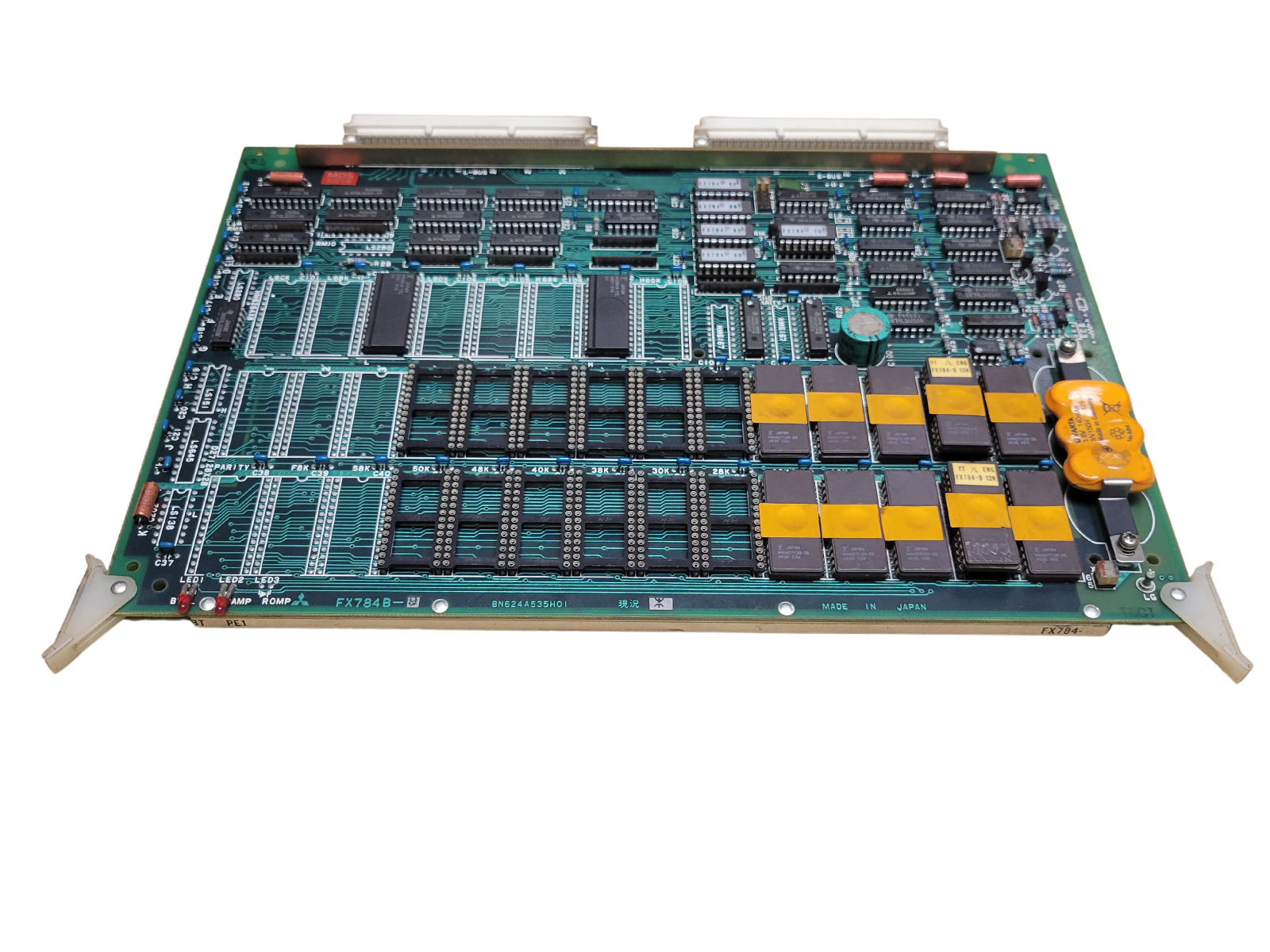 Electronic circuit board with various components on a white background