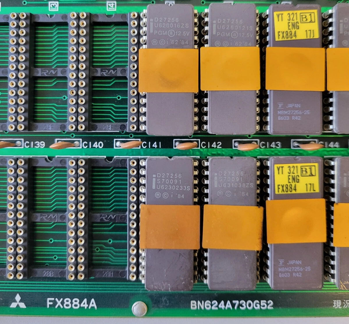 Close-up of computer hardware components on a green circuit board