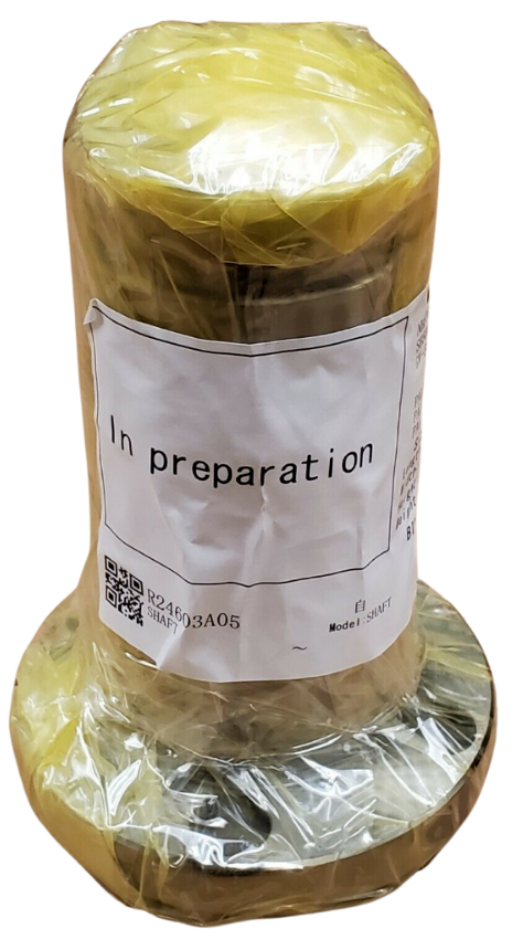 Roll of yellow fabric with a label indicating 'In preparation' on a white background