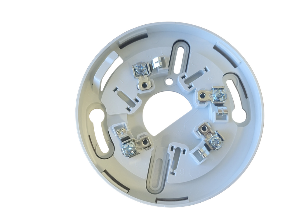 Round metal component with bolts on a white background