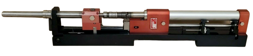 Mechanical device with a cylindrical component and red and black housing