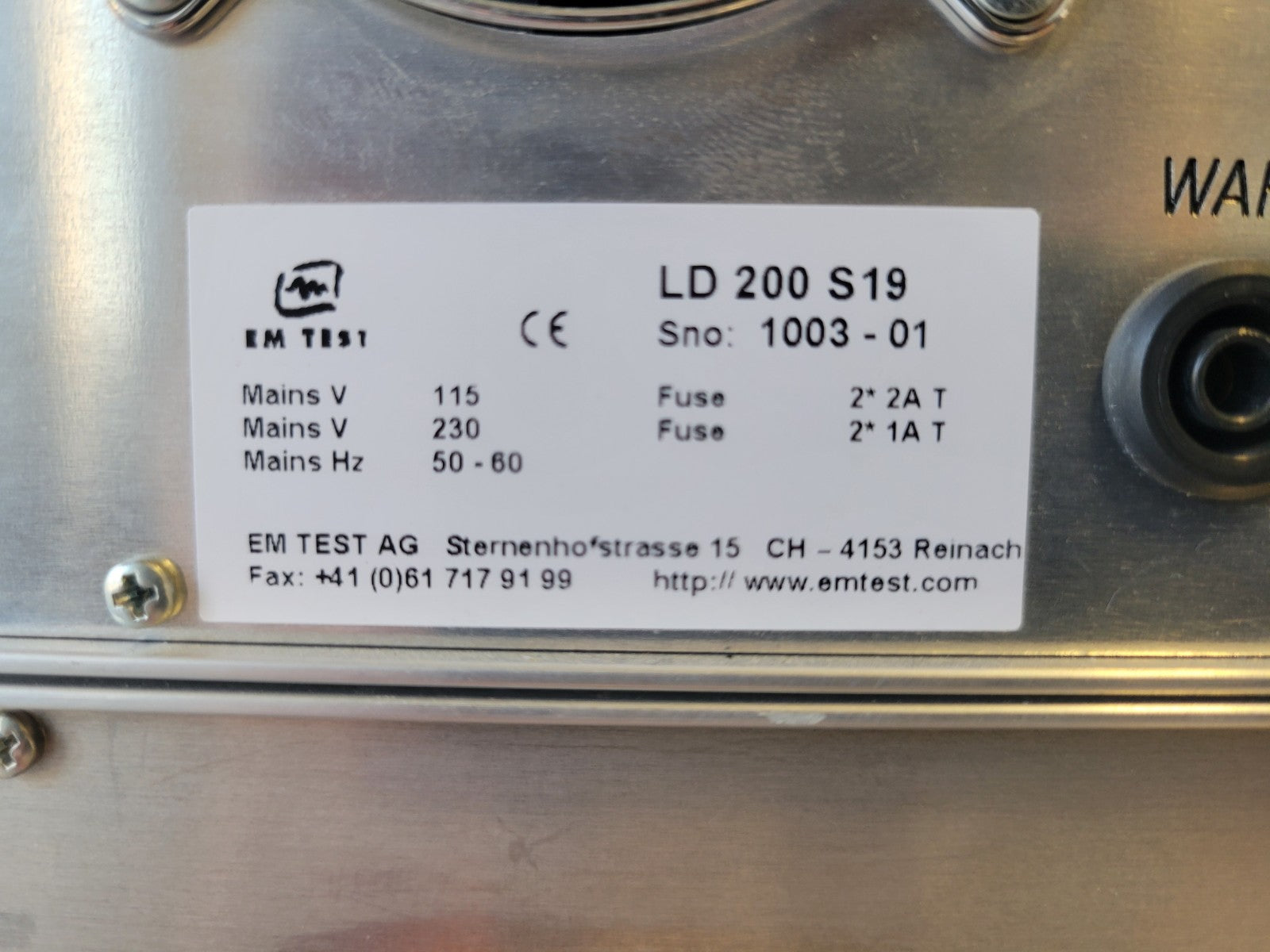 Metallic device with a label containing technical specifications and branding