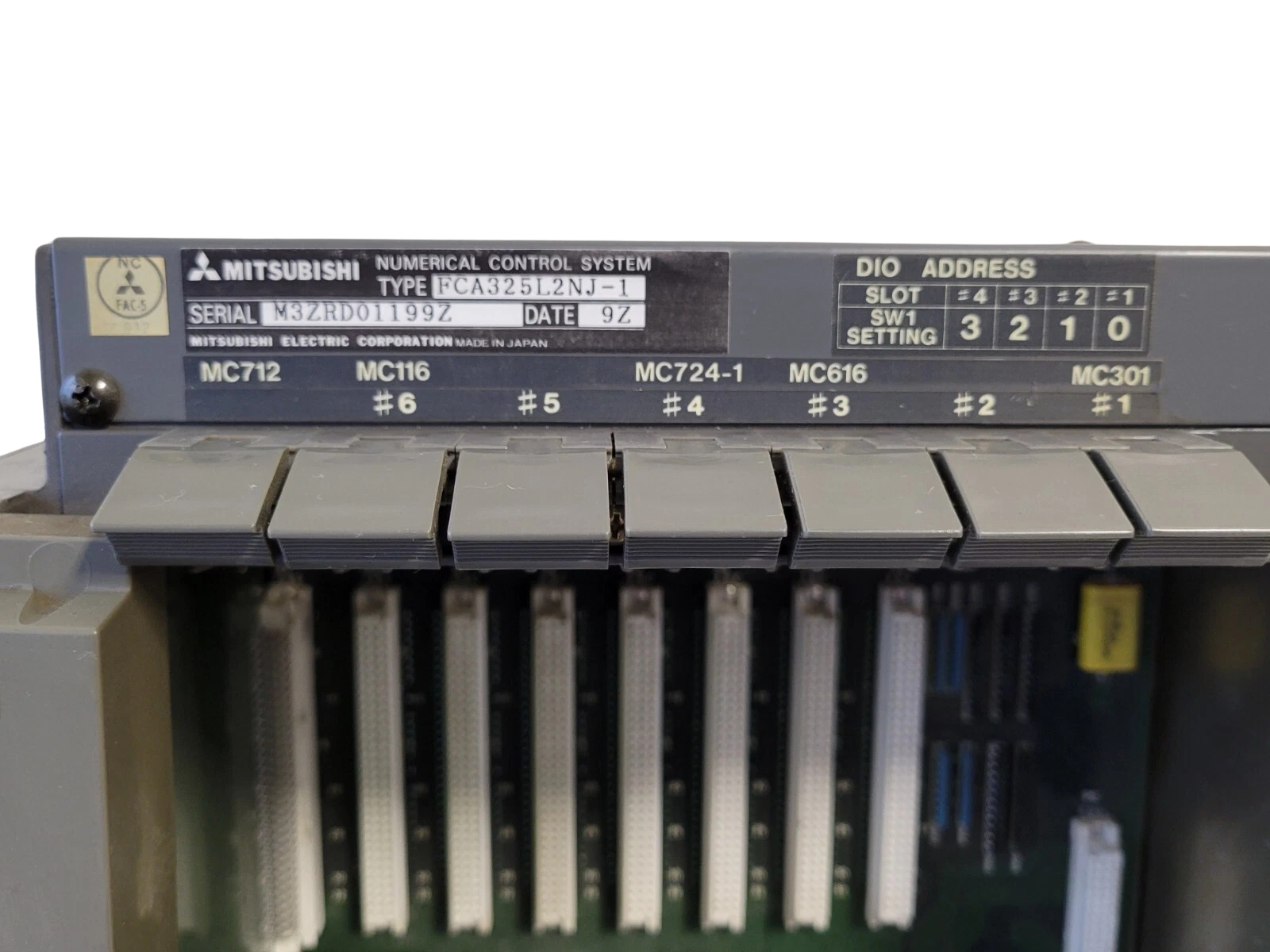 Mitsubishi numerical control system with various slots on a white background