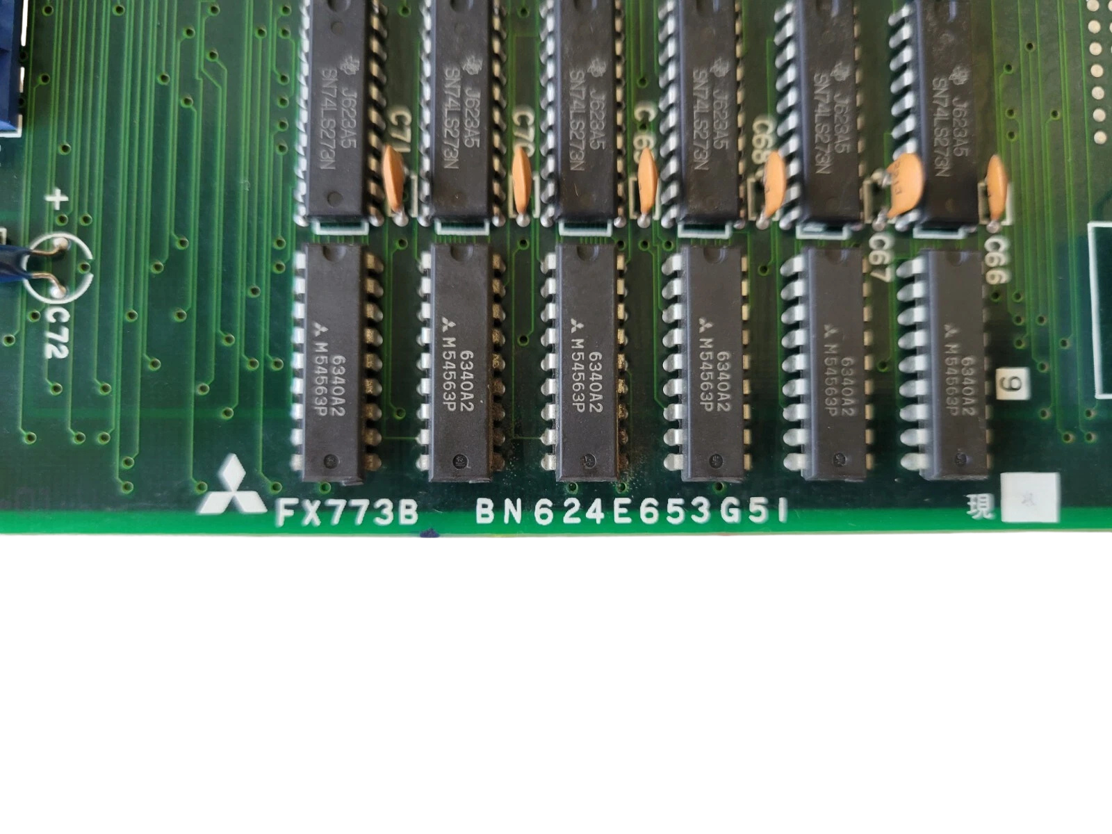 Close-up of a computer motherboard with various components.