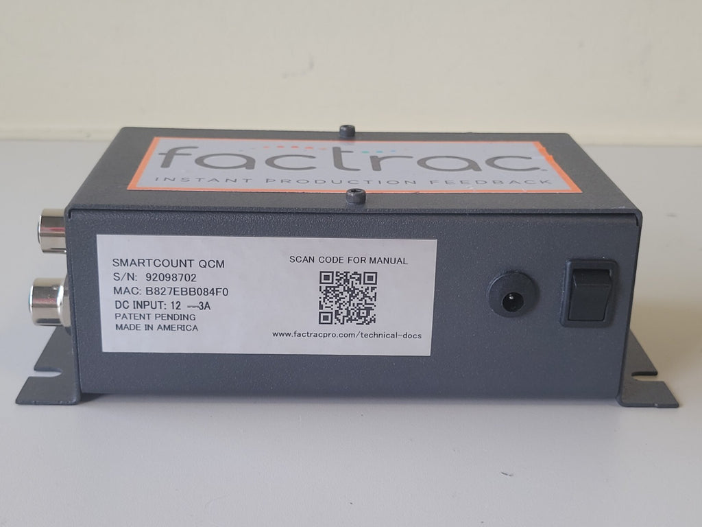 Factrac device with label and QR code on a white background