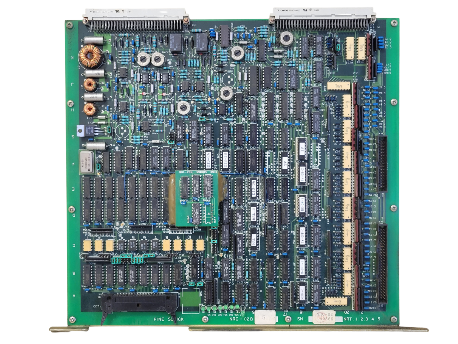 Electronic circuit board with various components on a white background