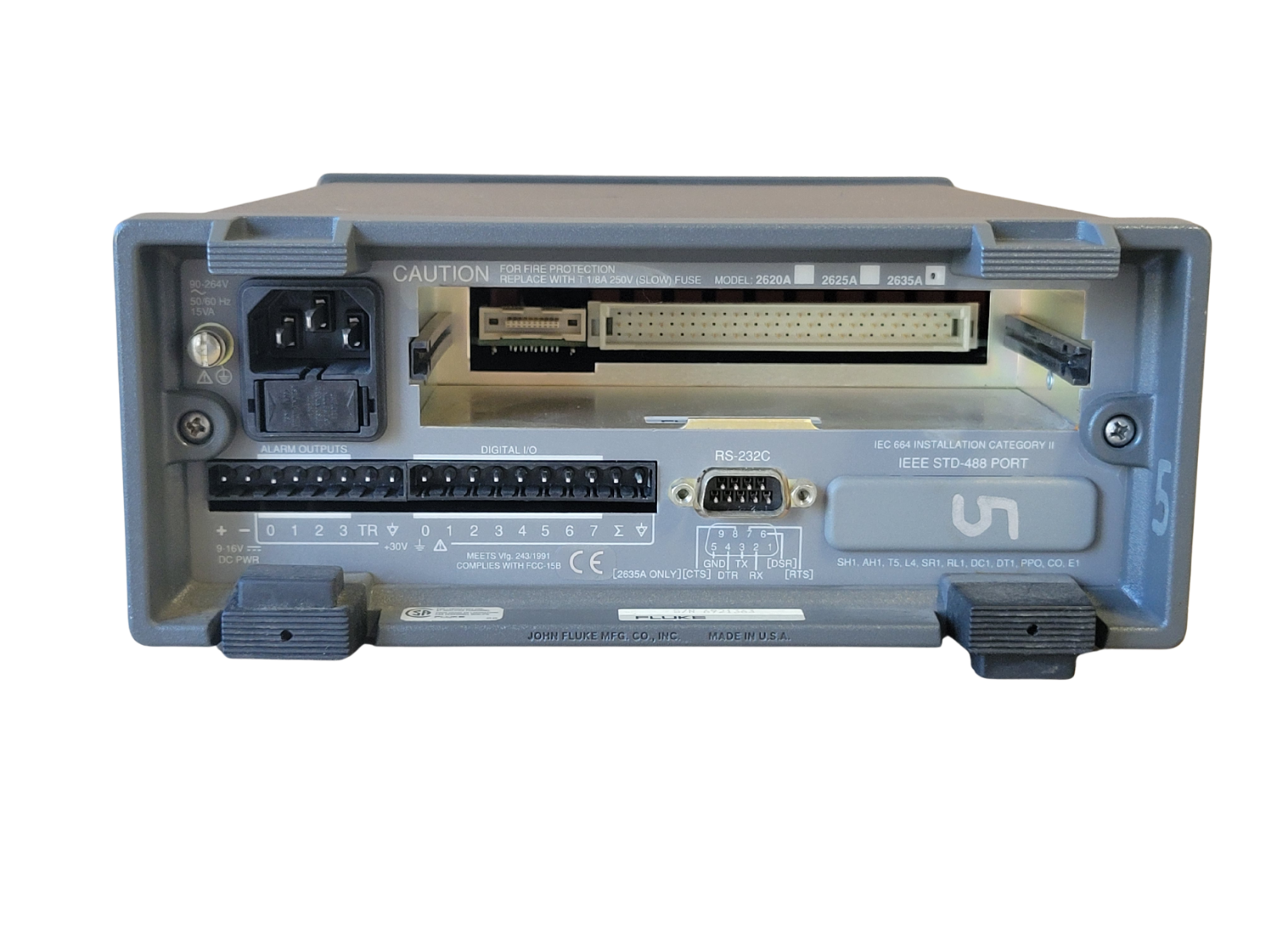 Back view of a electronic device with connectors and labels on a white background