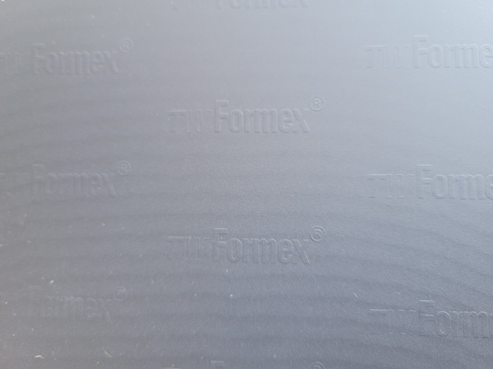 Textured gray surface with 'Formex' branding