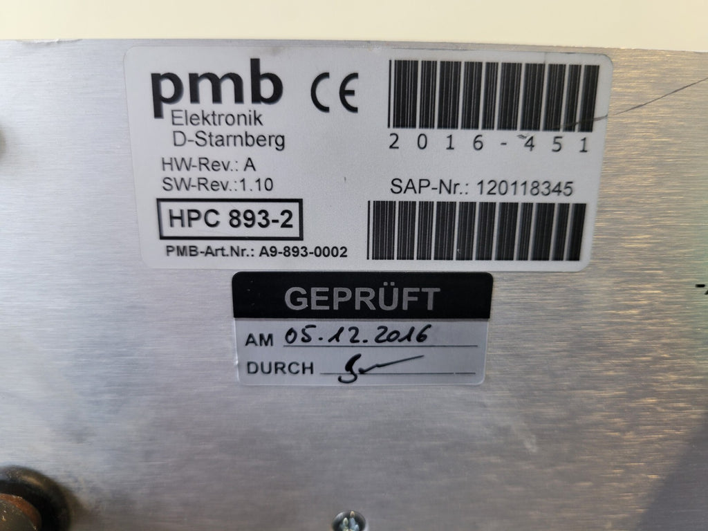 Label with technical specifications and barcodes on a metallic surface