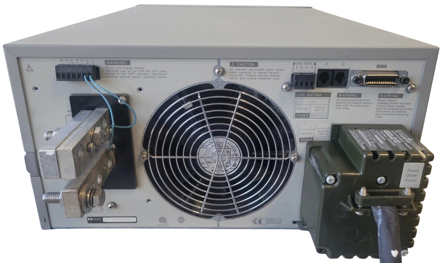 Back view of a electronic equipment with a fan and connectors on a white background