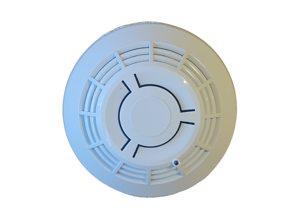 Round white smoke detector on a white background
