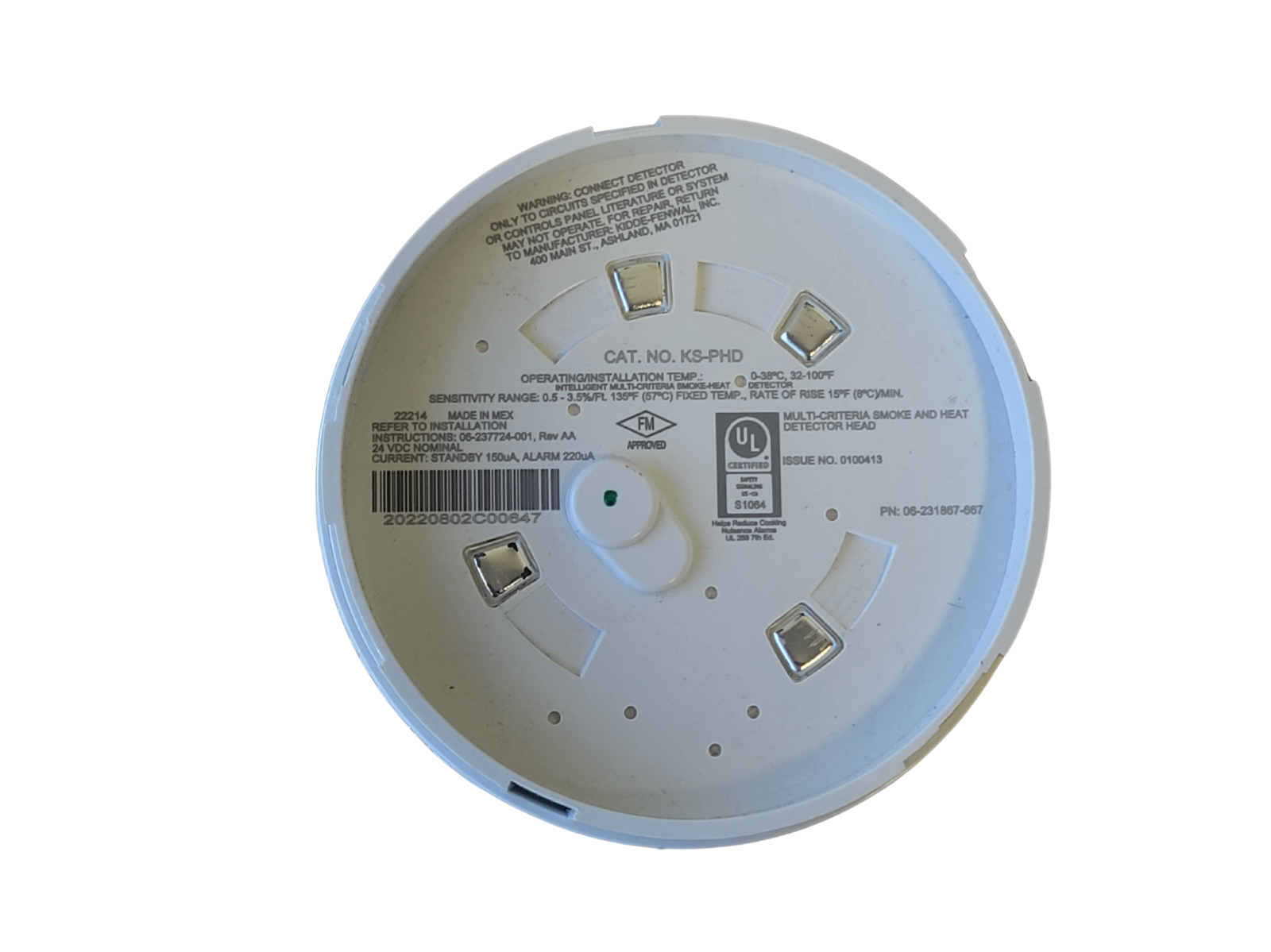 Back view of a smoke alarm with labels and certification marks on a white background