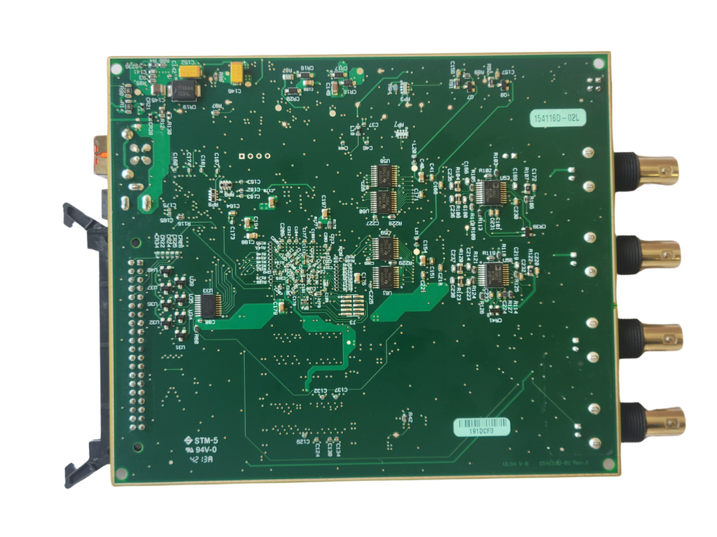Green electronic circuit board with various components on a white background