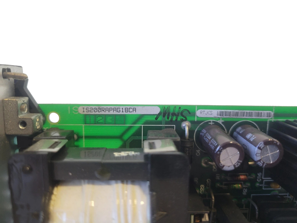 Close-up of electronic components on a circuit board with visible branding.