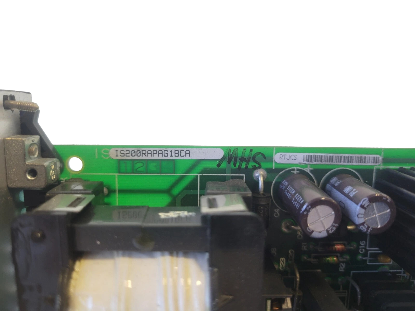 Close-up of electronic components on a circuit board with visible branding.