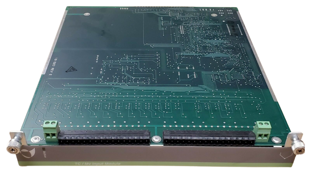 Green printed circuit board with electronic components on a white background