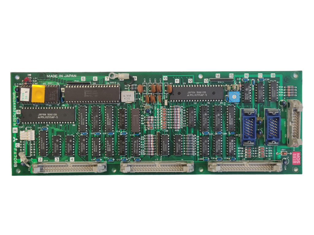 Electronic circuit board with various components on a white background