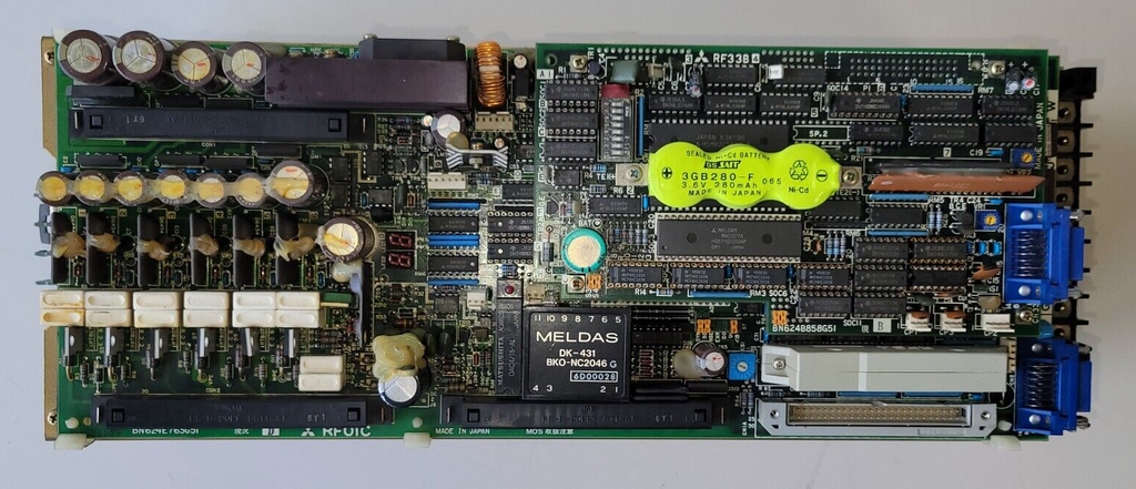 Computer motherboard with various components on a white background