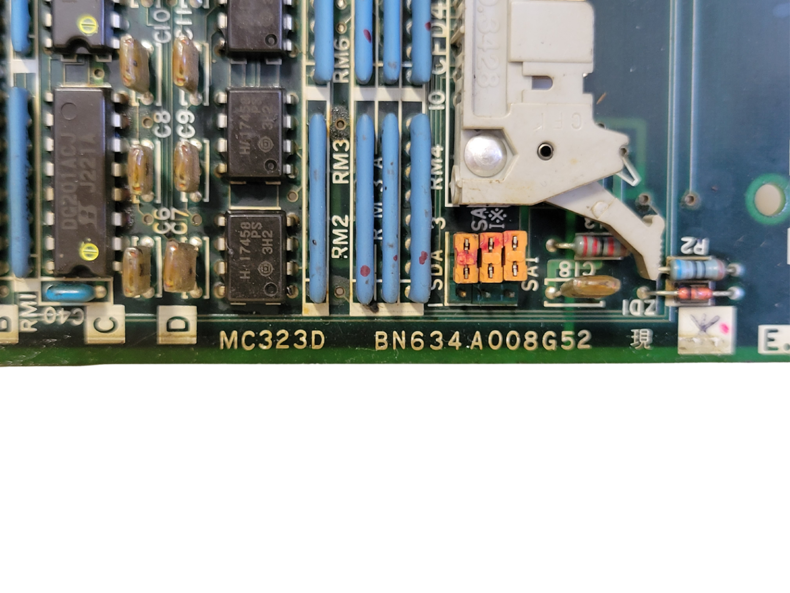 Close-up of a computer motherboard with various components.