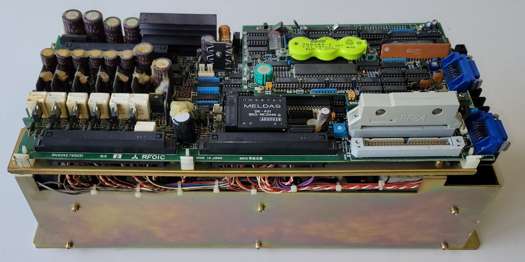 Electronic circuit board with various components on a white background