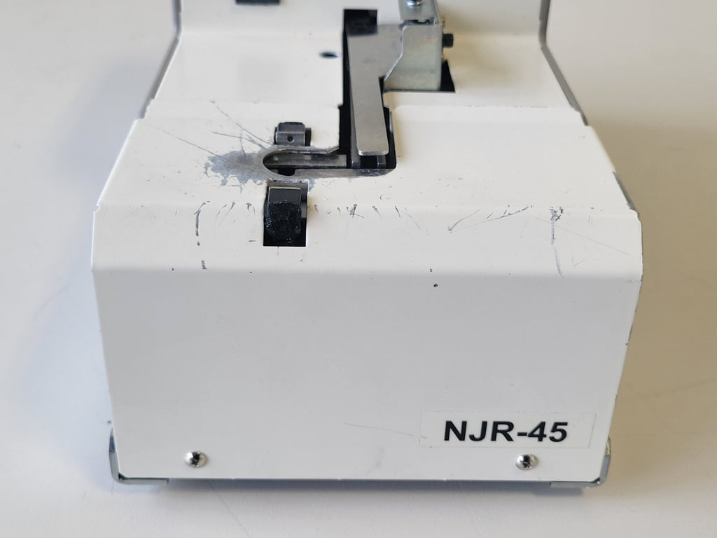 Sewing machine component with 'NJR-45' marking on a white background