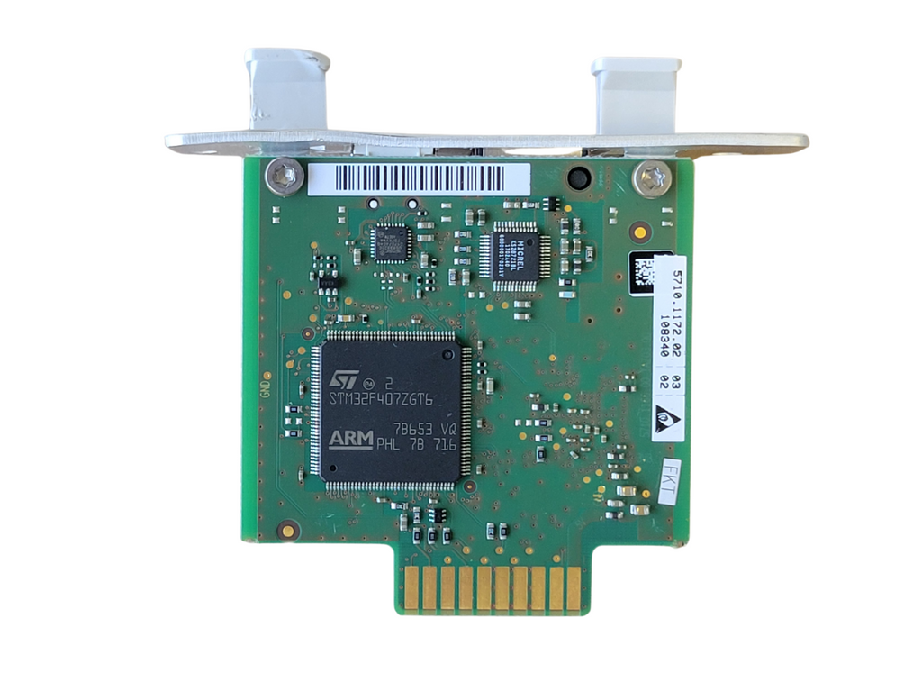 Green circuit board with electronic components on a white background