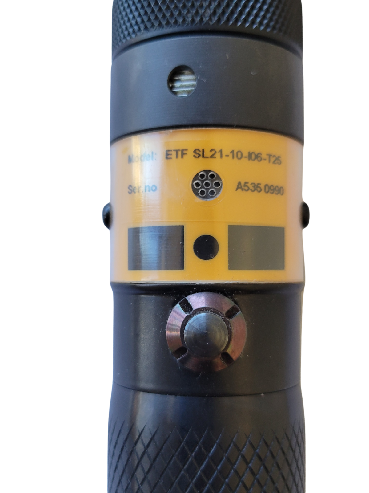 Close-up of a tool with a yellow and black design on a white background