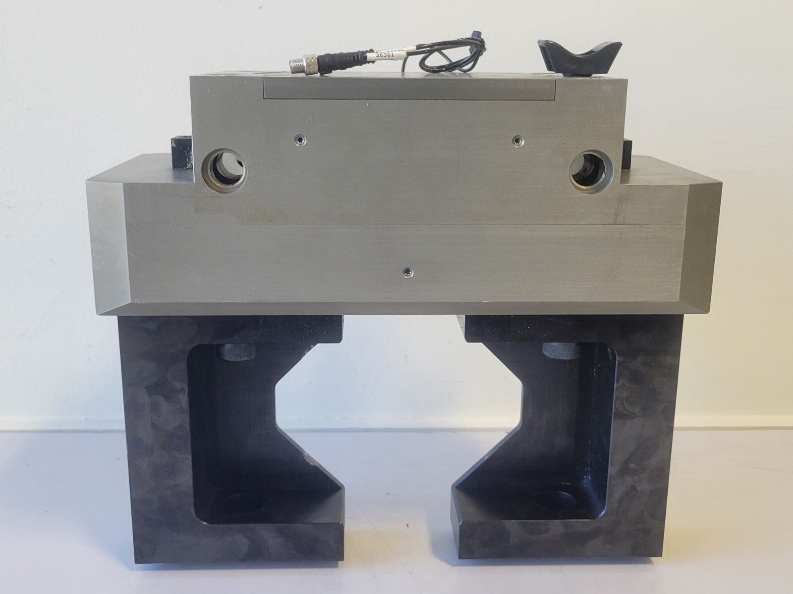 Metallic mechanical component on a white background