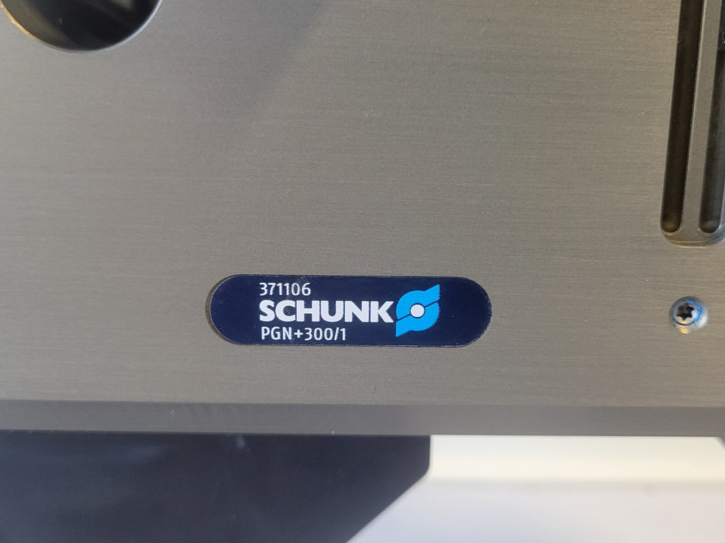 Schunk logo on a metallic surface with model number PGN+300/1