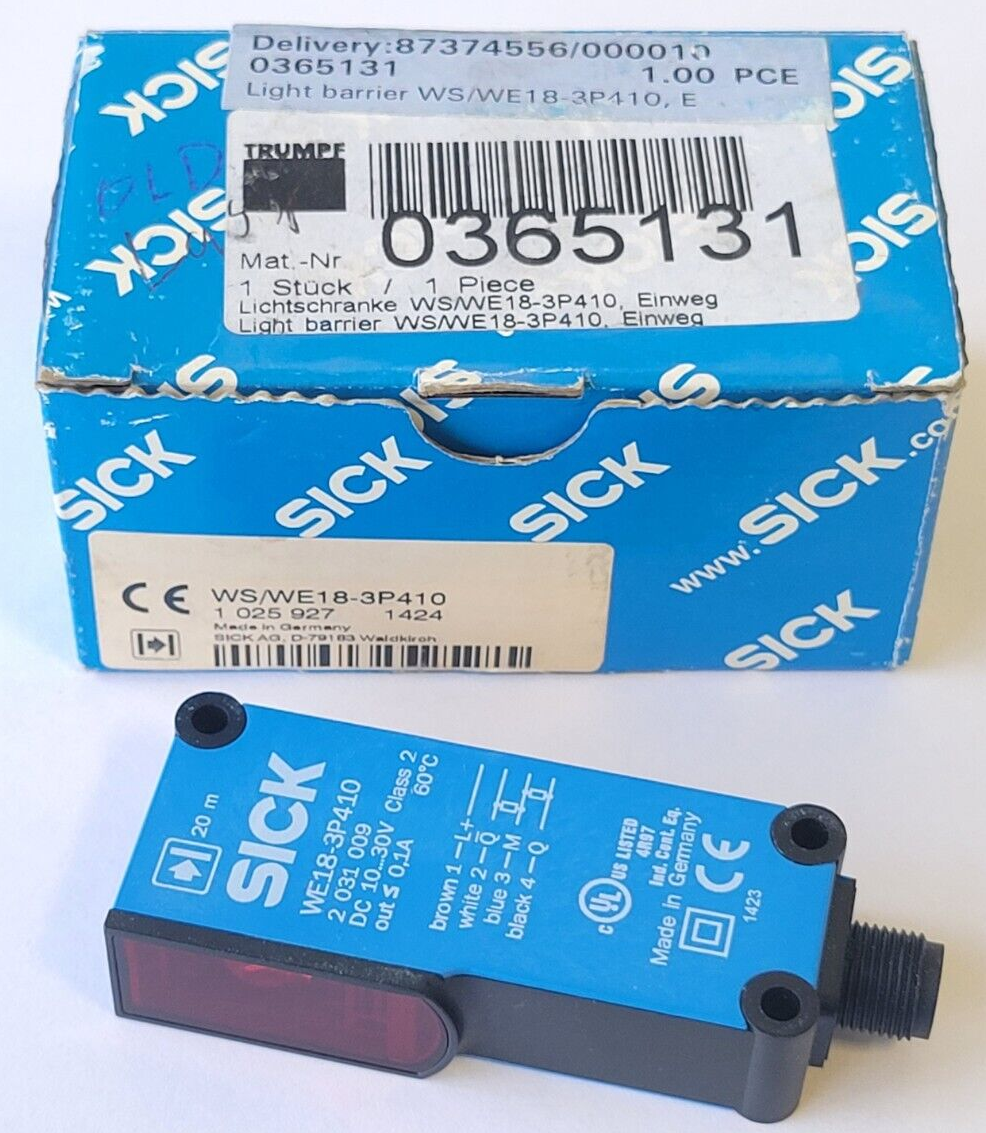 SICK light barrier with packaging on a white background