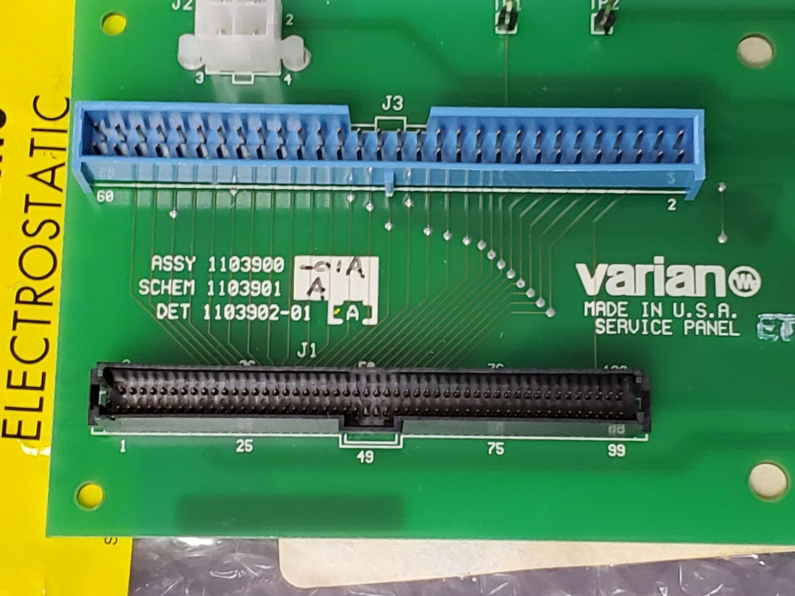 Green circuit board with electronic components and 'Varian' branding